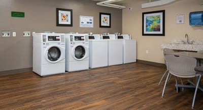 Laundry room with commercial washers and dryers
