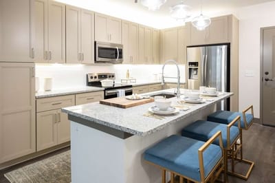 Modern kitchen interior with dining setup.