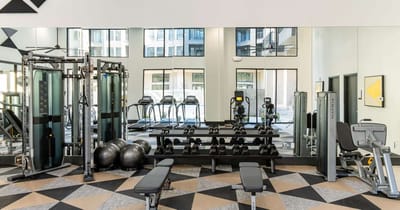 Well-equipped gym area within the assisted living facility