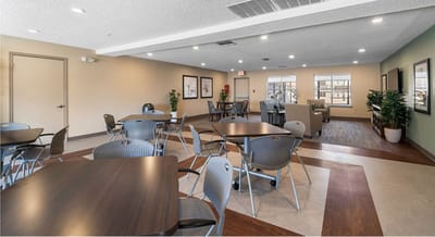 Modern common area with tables and seating.
