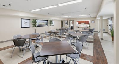 Bright dining area with tables and chairs