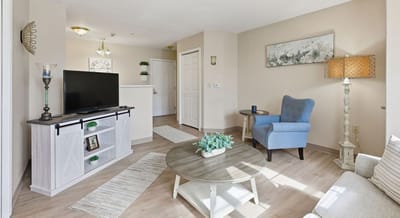 Cozy living room area with modern decor and furniture.