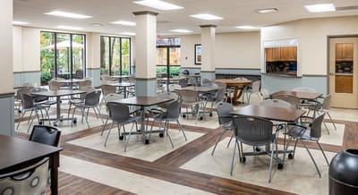 Dining room with tables and chairs set up