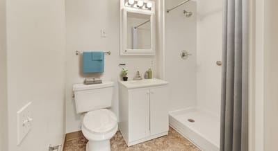 Clean bathroom with a shower and amenities.