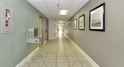 Hallway with artwork and water fountain