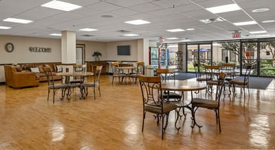 Bright common area with seating and tables
