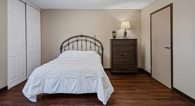 Cozy bedroom with a bed and dresser