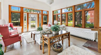 Bright common area with comfortable seating and large windows.