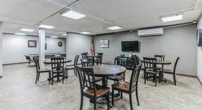 Interior common area with tables and chairs