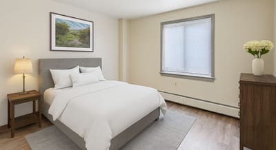 Cozy bedroom with minimal decor and natural light.