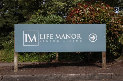 Facility sign for Life Manor Senior Living