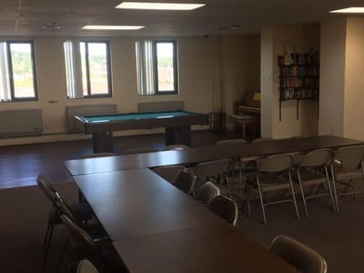 Common area with tables and recreational equipment