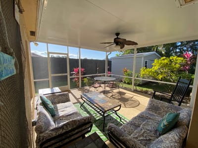 Outdoor seating area with tropical plants