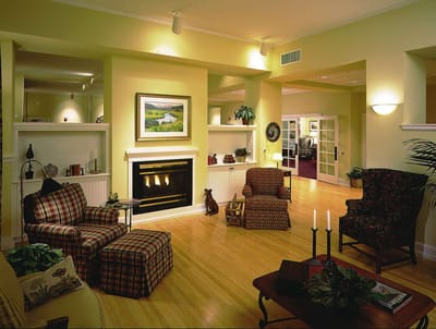 Cozy interior common area with seating and fireplace
