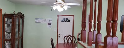 A cozy dining area with a round table and chairs