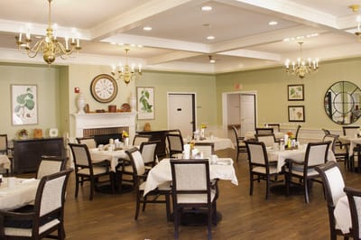 Bright dining room with round tables and decorative accents