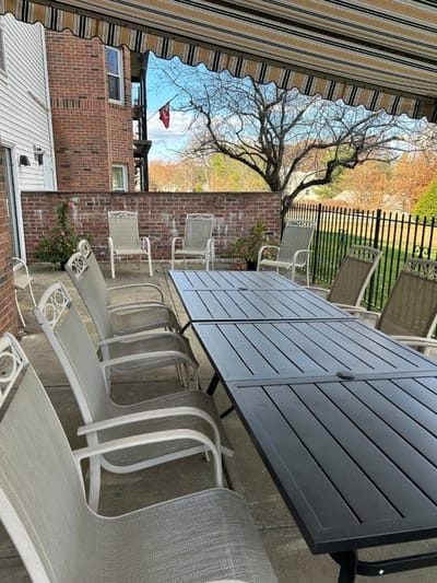 Outdoor seating area with tables and chairs