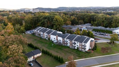 Aerial view of the assisted living facility amidst fall foliage