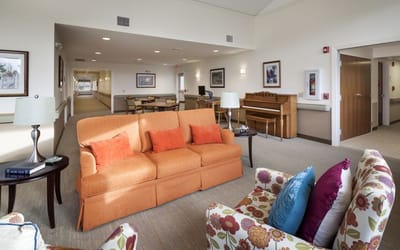 Bright common area with comfortable seating in the facility