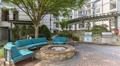 Outdoor seating area with fire pit and grill