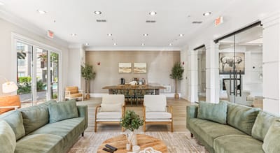 Bright common area with comfortable seating and dining table