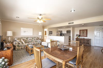Bright living room with a cozy seating area and dining space