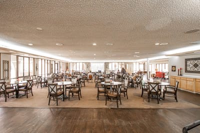 Bright dining room with tables arranged for meals