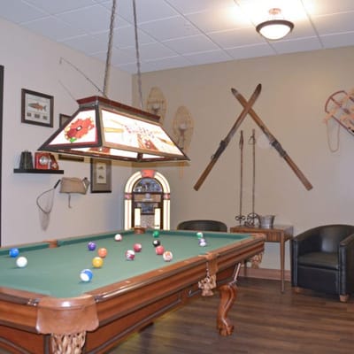 Interior game room with pool table and decor