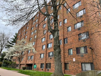 Exterior view of Marshall Apartments with trees