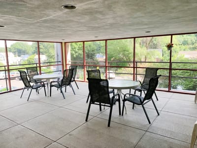 Outdoor seating area with tables and chairs