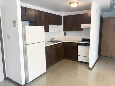 A kitchen area in a senior living apartment