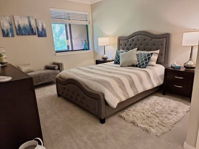 Cozy resident room with a bed and decorative elements