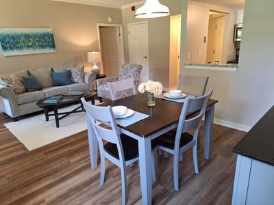Bright living room and dining area in a senior living facility