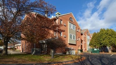 Exterior view of Dimitry J Kamanetsky Estates in autumn