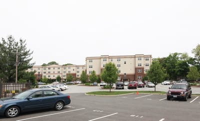 Exterior view of RiverView Apartments and parking area