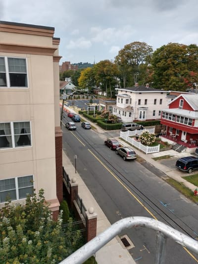 Street view of RiverView Apartments with surrounding buildings