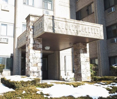 Exterior entrance of Harbor Towers facility