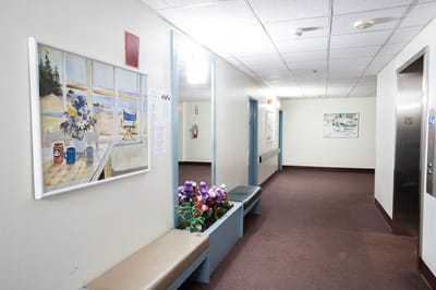 Interior hallway with seating and artwork