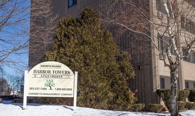 Exterior view of Harbor Towers sign in winter