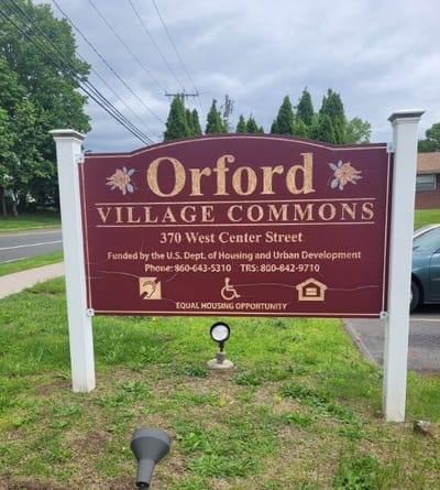 Sign displaying Orford Village Commons information