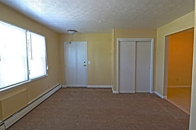 Interior view of an apartment with carpet and light walls