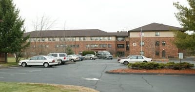 Exterior view of St Elizabeth Manor with parking lot