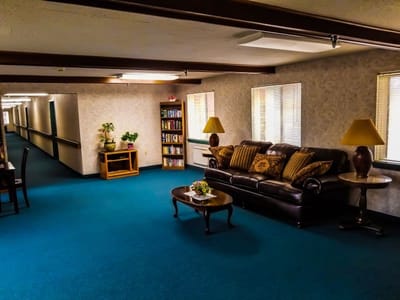 Interior common area with seating and bookshelves