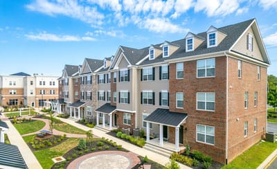 Exterior view of Linden Hill Station Apartments with landscaped garden