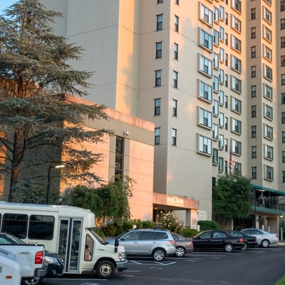 Exterior view of H. Fletcher Brown Apartments with parking