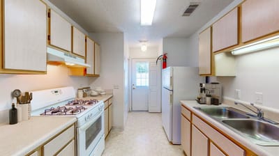 Modern kitchen with appliances and ample natural light
