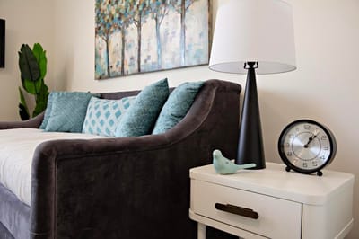 Cozy living room corner with lamp and clock