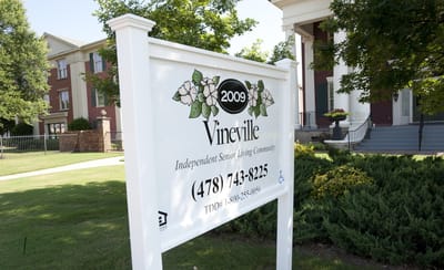 Facility sign outside with name and contact information