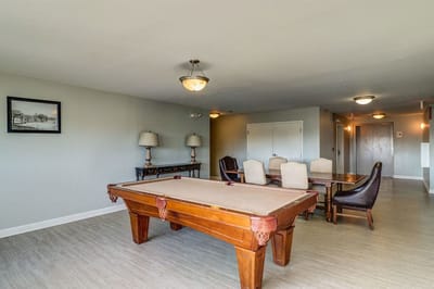 Common area with a pool table and seating