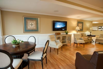 Bright common area with comfortable seating and artwork